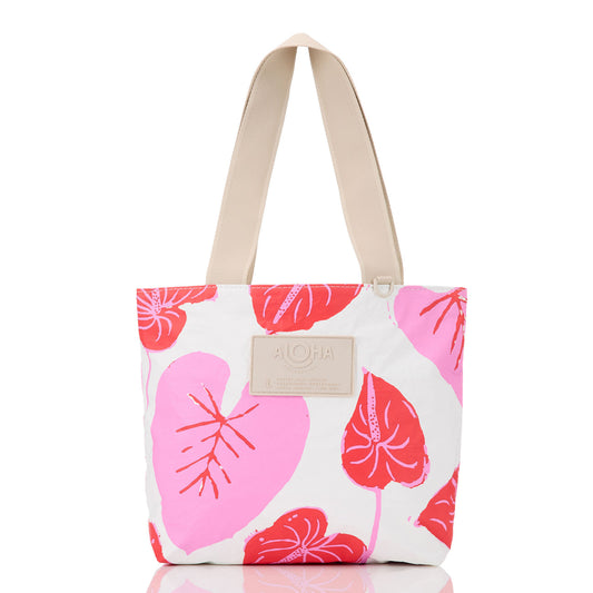 Tote bag with pink floral pattern on a white background