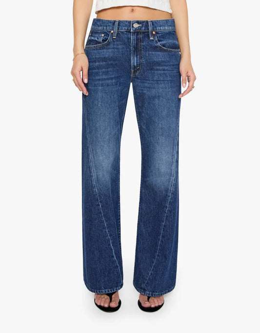 A model wearing a pair of medium-wash blue wide-leg jeans, shown from the waist down against a plain white background.