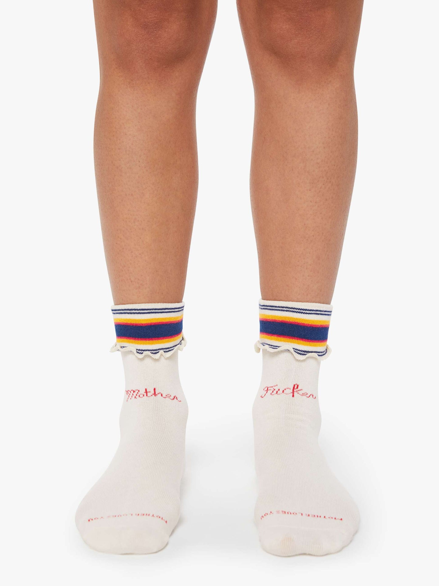 White socks with colorful stripes and text on a white background
