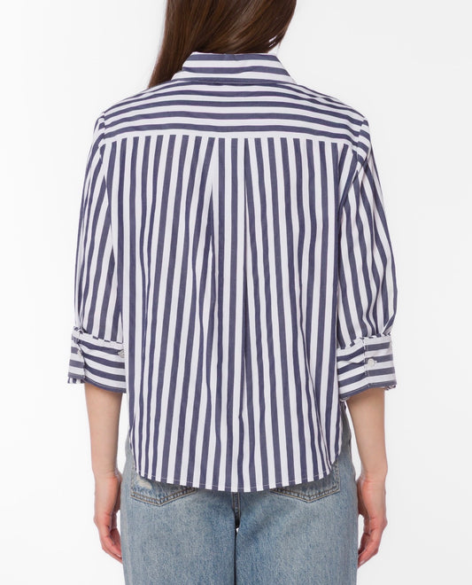 Person wearing a blue and white striped shirt on a white background