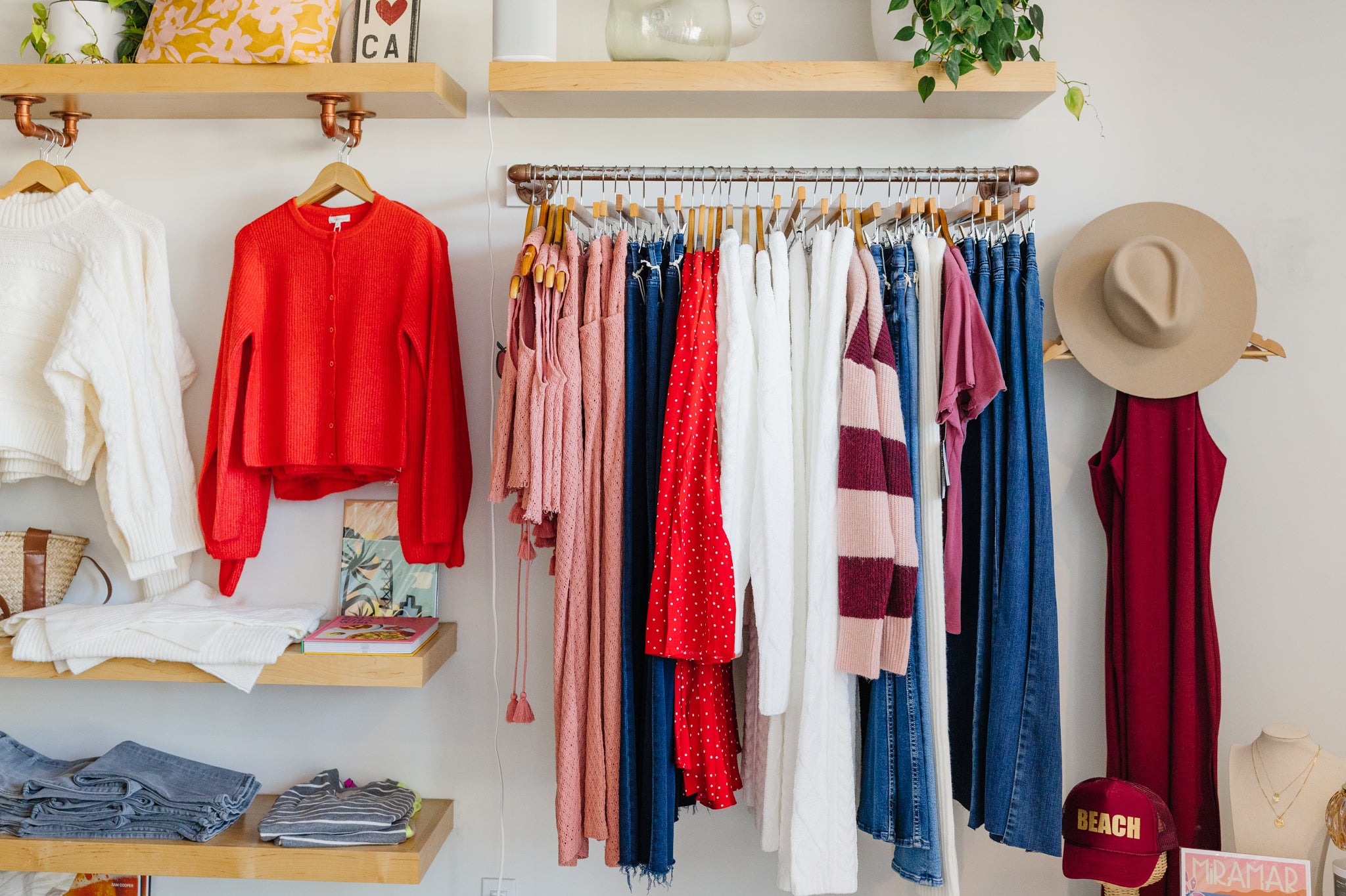 Clothing rack with various garments in a store setting