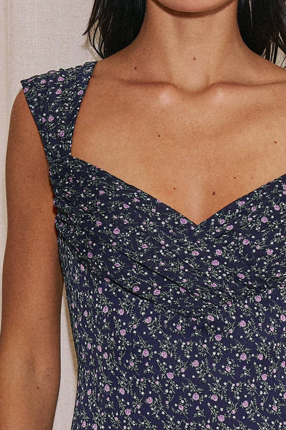 Navy floral dress with a plain background