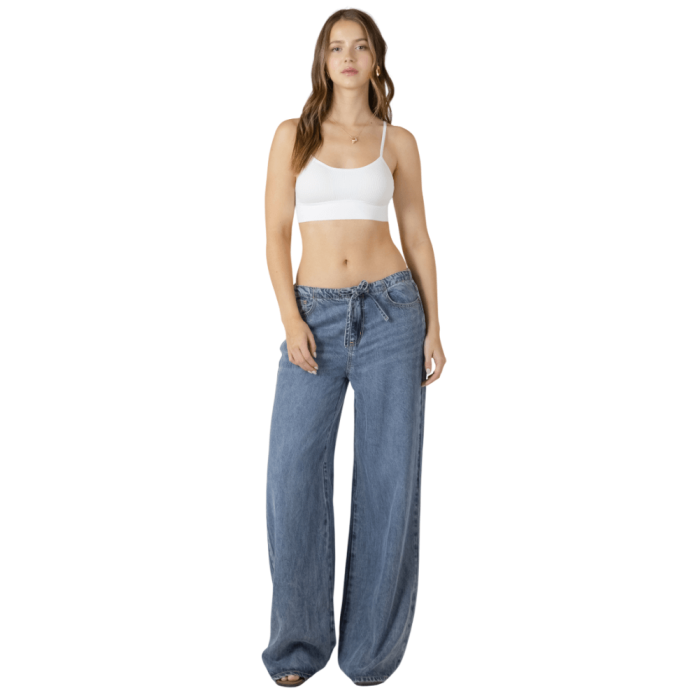 Woman in white tank bra top.