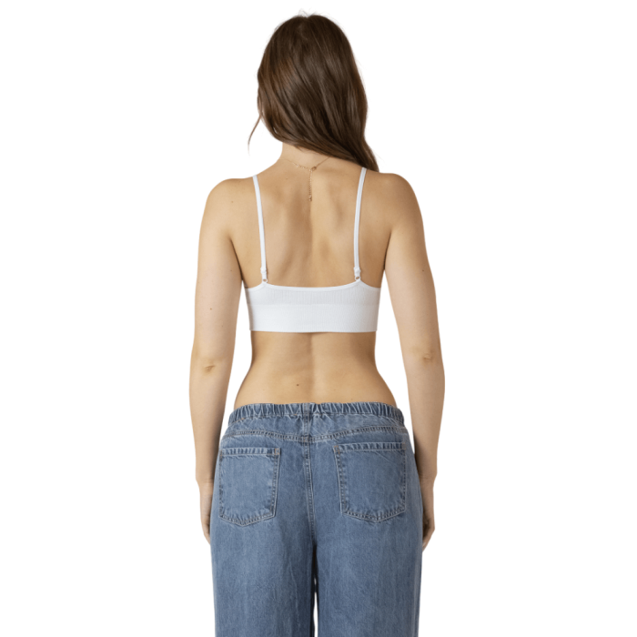 Back of woman in white tank bra top.