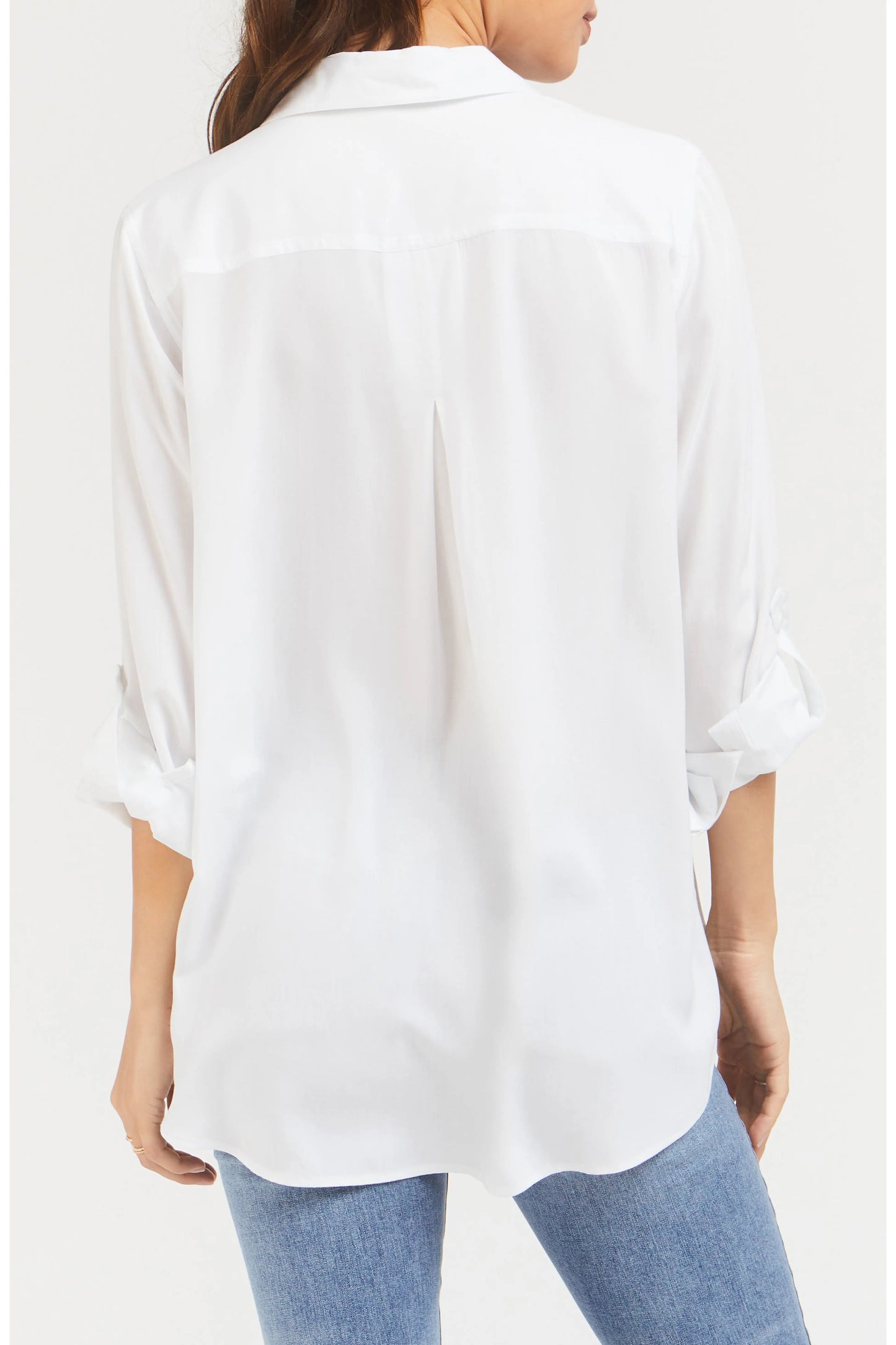 White shirt worn by a person on a white background
