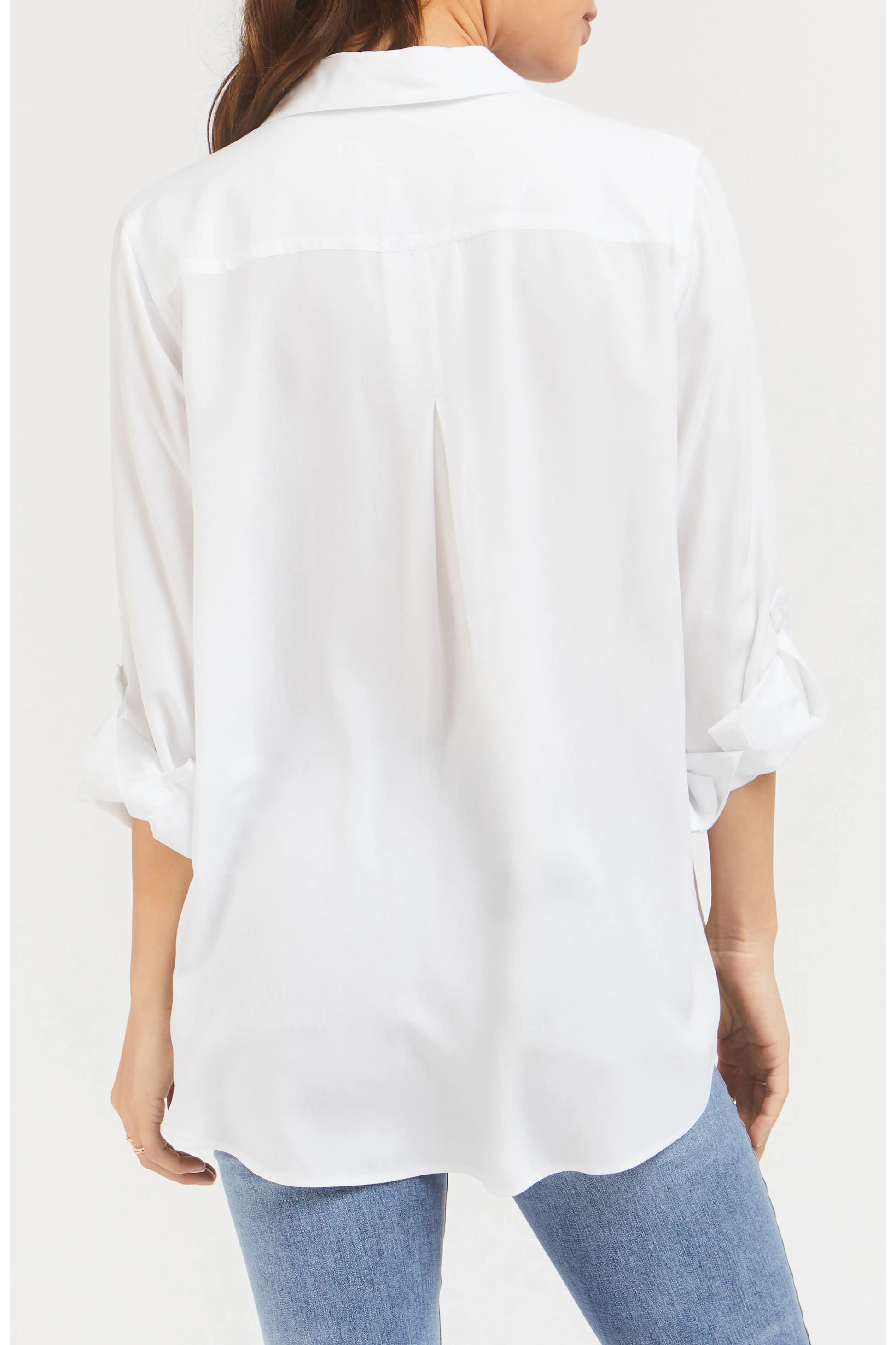 White shirt worn by a person on a white background