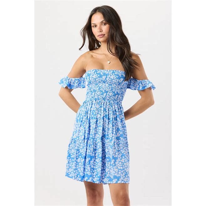 Woman wearing blue dress on white background.