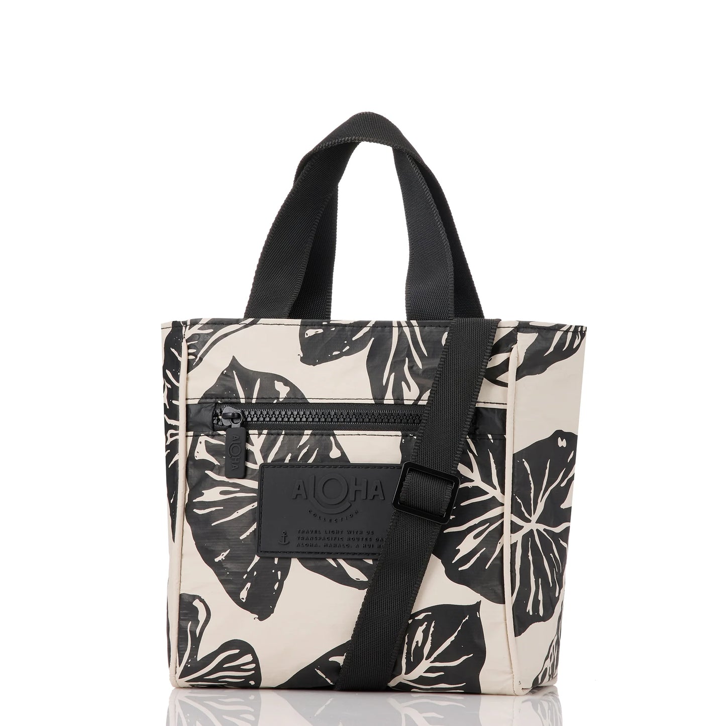 Tote bag with black leaf pattern and black strap on a white background