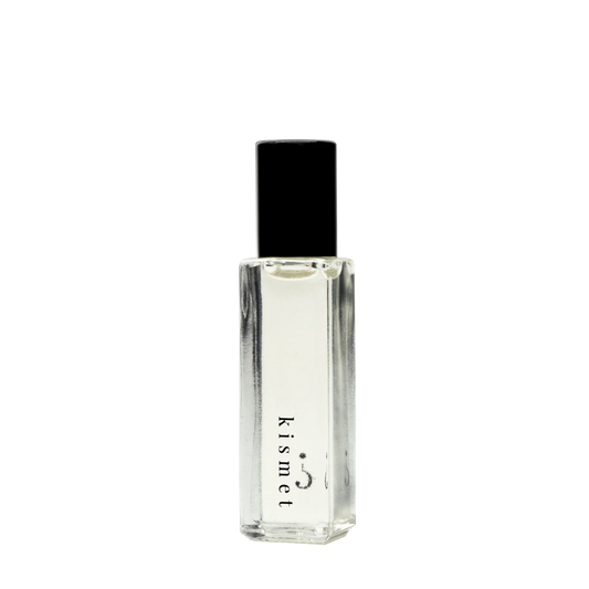 Roller ball perfume labeled 'Kismet' on a white background.
