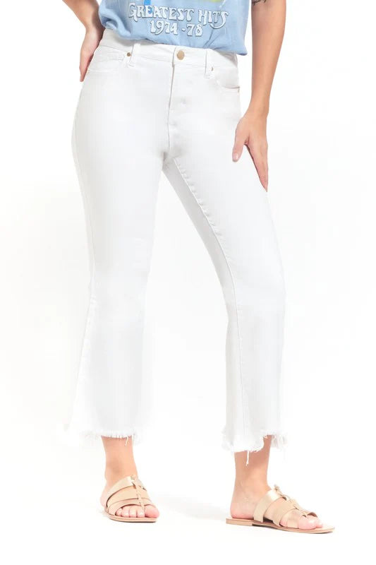 Person wearing white jeans on a white background
