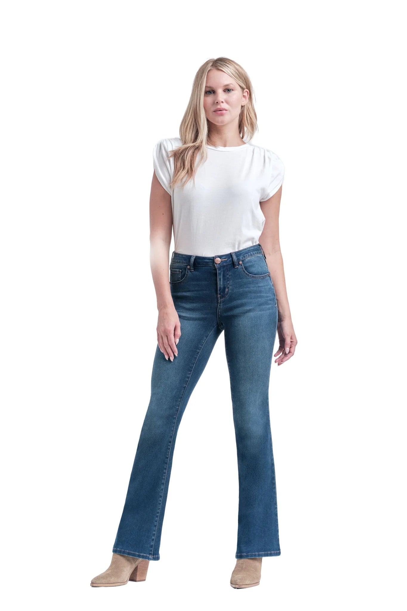 Woman wearing blue jeans and a white top on a white background