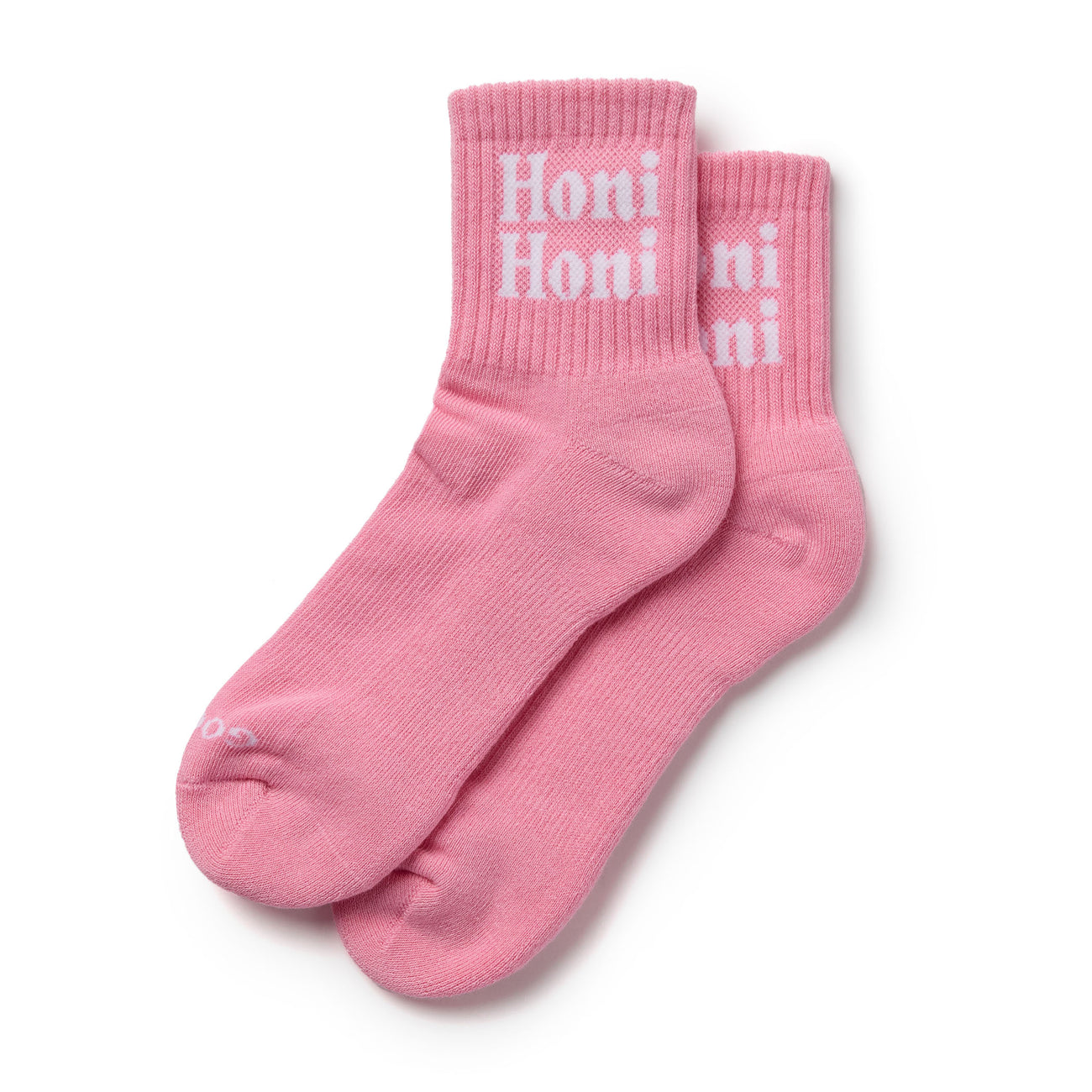 Pink socks with 'Honi' text on a white background